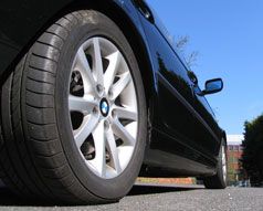 Black car with new tyres installed